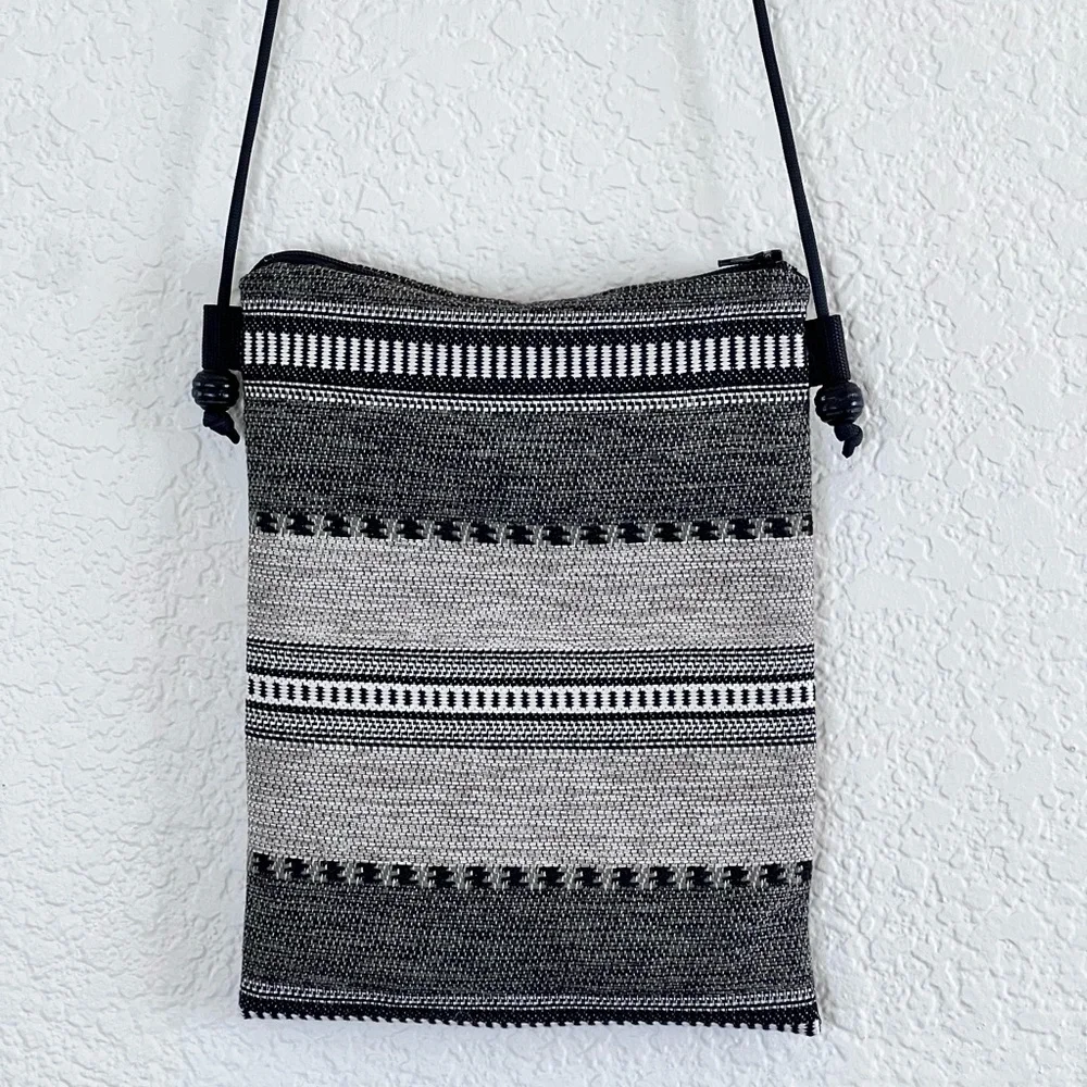 Like new black and white woven crossbody bag small